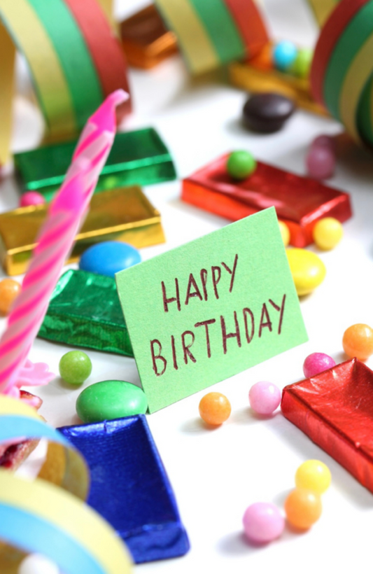 Happy Birthday With Candy And A Candle