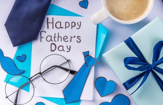 Happy Father’s Day On Paper With Eyeglasses, Tie, Coffee Cup And A Gift
